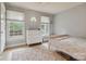 Inviting bedroom with hardwood floors and two windows allowing ample natural light at 1821 Bonnie Ln, Charlotte, NC 28213
