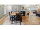 Dining room with hardwood floors, views to bonus room, living room, and kitchen, providing an open and inviting layout at 1821 Bonnie Ln, Charlotte, NC 28213