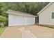 Detached two-car garage and screened-in porch, offering ample parking and outdoor living space at 1821 Bonnie Ln, Charlotte, NC 28213