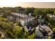 Aerial view of modern townhouses nestled in a lush, tree-filled neighborhood near the city at 2011 Hamorton Pl, Charlotte, NC 28205