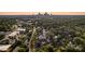Aerial view of 2011 Hamorton Place, Charlotte, surrounded by lush greenery, with the city skyline in the background at 2011 Hamorton Pl, Charlotte, NC 28205