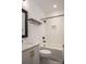 Well-lit bathroom featuring white subway tile, shower and tub with modern fixtures at 2011 Hamorton Pl, Charlotte, NC 28205