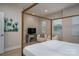 Bright bedroom features a four-poster bed, sitting area, and modern finishes at 2011 Hamorton Pl, Charlotte, NC 28205