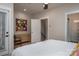 Bright bedroom featuring a bed, a dresser, a ceiling fan, and two windows providing natural light at 2011 Hamorton Pl, Charlotte, NC 28205