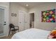 Bedroom features a chair, bright white trim and an open door to another room at 2011 Hamorton Pl, Charlotte, NC 28205