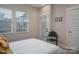 Bedroom features windows, bright white trim and an open door to the outside at 2011 Hamorton Pl, Charlotte, NC 28205