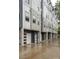 A row of modern townhomes featuring individual garages and contemporary design, set in a desirable neighborhood at 2011 Hamorton Pl, Charlotte, NC 28205