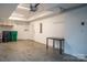 Spacious garage with room for storage, and finished walls and flooring at 2011 Hamorton Pl, Charlotte, NC 28205