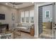 Well-lit living room with hardwood floors, comfortable seating and an open doorway to a private outdoor space at 2011 Hamorton Pl, Charlotte, NC 28205