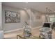 Bright open living space adjacent to the kitchen showcasing hardwood floors, modern decor, and a staircase at 2011 Hamorton Pl, Charlotte, NC 28205