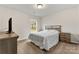 Relaxing bedroom with natural light and neutral walls at 2025 Slater Rd, Charlotte, NC 28216