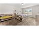 Bedroom with ample natural light, plush carpeting, a neutral color scheme, and a small crib at 2025 Slater Rd, Charlotte, NC 28216