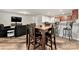 Open concept dining area, flowing into the living room and modern kitchen at 2025 Slater Rd, Charlotte, NC 28216