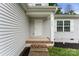 Close-up of the front porch and door with light gray siding and white trim at 2025 Slater Rd, Charlotte, NC 28216