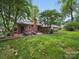A spacious backyard features a patio with an outdoor seating area perfect for relaxing and entertaining guests at 2026 Knell Dr, Charlotte, NC 28212