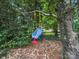 Backyard with green yard and swing at 2026 Knell Dr, Charlotte, NC 28212