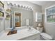 Well-lit bathroom featuring a large mirror, a window and essential amenities at 2026 Knell Dr, Charlotte, NC 28212