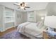 Inviting bedroom featuring hardwood floors, bright windows, and neutral tones at 2026 Knell Dr, Charlotte, NC 28212