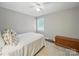 Bedroom with neutral walls, hardwood floors, ceiling fan, and comfortable furnishings at 2026 Knell Dr, Charlotte, NC 28212