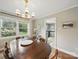 Dining room featuring a chandelier, window view of a garden, hardwood floors and a view to the kitchen at 2026 Knell Dr, Charlotte, NC 28212