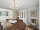 Elegant dining room with chandelier and views into the living room at 2026 Knell Dr, Charlotte, NC 28212