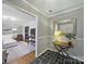 Stylish foyer leading to the living room with hardwood and tile flooring at 2026 Knell Dr, Charlotte, NC 28212