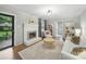 Inviting living room with a fireplace, an outside view, hardwood floors, and white accents, creating a cozy atmosphere at 2026 Knell Dr, Charlotte, NC 28212