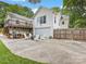 Spacious backyard featuring a patio, outdoor seating, and a detached garage at 2112 Chatham Ave, Charlotte, NC 28205