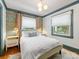Cozy bedroom featuring natural light from a large window, highlighting the room's bright decor at 2112 Chatham Ave, Charlotte, NC 28205