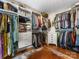 Bright walk-in closet with custom built-ins for ample storage and a stylish accent rug at 2112 Chatham Ave, Charlotte, NC 28205
