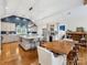 Modern kitchen with island, stainless steel appliances, and adjacent dining area at 2112 Chatham Ave, Charlotte, NC 28205