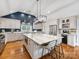 Island kitchen featuring stainless steel appliances, granite countertops, and modern lighting at 2112 Chatham Ave, Charlotte, NC 28205