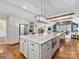 Open-concept kitchen with island, stainless steel appliances, and view into the living area at 2112 Chatham Ave, Charlotte, NC 28205