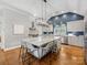Island kitchen with granite countertops, stainless appliances, and pendant lighting at 2112 Chatham Ave, Charlotte, NC 28205