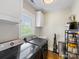 Efficient laundry room with modern washer and dryer, ample cabinetry, and bright natural light at 2112 Chatham Ave, Charlotte, NC 28205