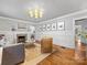 Stylish living room with fireplace and hardwood floors, perfect for entertaining at 2112 Chatham Ave, Charlotte, NC 28205