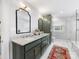 Elegant main bathroom featuring double vanity, walk-in shower, sleek fixtures, and stylish decor at 2112 Chatham Ave, Charlotte, NC 28205