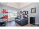 Cozy bonus room with movie decor, a black leather couch, and a beverage fridge at 220 Otman Ct, Rock Hill, SC 29732