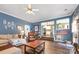 Open-concept living room with view to the kitchen and hardwood floors at 220 Otman Ct, Rock Hill, SC 29732