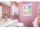 Charming powder room features a vanity, toilet, and pink walls at 220 Otman Ct, Rock Hill, SC 29732