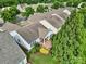 Aerial view of a neighborhood highlighting a home with a covered patio and lush landscaping at 2213 Hartwell Ln # 84, Indian Land, SC 29707