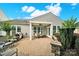 The backyard features a covered patio with outdoor furniture, a grill, and well-maintained landscaping at 2213 Hartwell Ln # 84, Indian Land, SC 29707