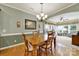Inviting dining room adjacent to living area featuring wood table, chandelier, and calming neutral color palette at 2213 Hartwell Ln # 84, Indian Land, SC 29707