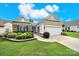 Single-story home features a two-car garage, a stone exterior, and manicured landscaping at 2213 Hartwell Ln # 84, Indian Land, SC 29707