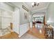 Light and airy hallway with hardwood floors leading to the living room and bathroom at 2213 Hartwell Ln # 84, Indian Land, SC 29707