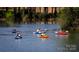 People kayaking on a serene lake, enjoying outdoor recreation and leisure at 2213 Hartwell Ln # 84, Indian Land, SC 29707