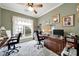 Office with sage green walls, a ceiling fan, and two desks with black office chairs at 2213 Hartwell Ln # 84, Indian Land, SC 29707