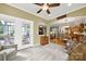 Bright sunroom featuring neutral carpet, several windows and seamless flow into dining and living areas at 2213 Hartwell Ln # 84, Indian Land, SC 29707