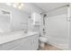 Bright bathroom featuring a shower-tub combo and modern vanity with a large mirror at 230 Dawn Mist Ln, Fort Mill, SC 29708