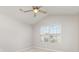Bedroom with neutral walls, a ceiling fan, and a bright window offering natural light at 230 Dawn Mist Ln, Fort Mill, SC 29708